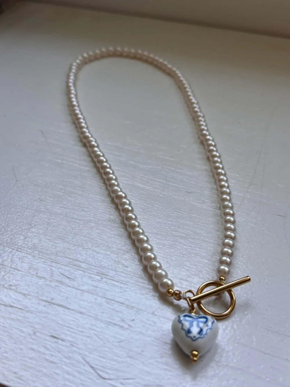 Glass Pearl Necklace with Blue and White Heart Charm - Gold Toggle - Picture 2 of 3